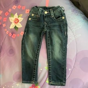 {True religion} jeans with pink stitching